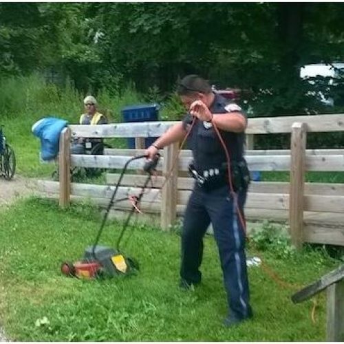 OFFICERS STEP IN TO HELP WHEELCHAIR-BOUND MAN MOW HIS LAWN